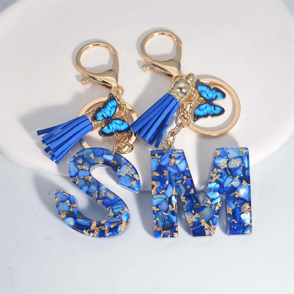 Blue Acrylic Initial Keychain with Butterfly and Tassel