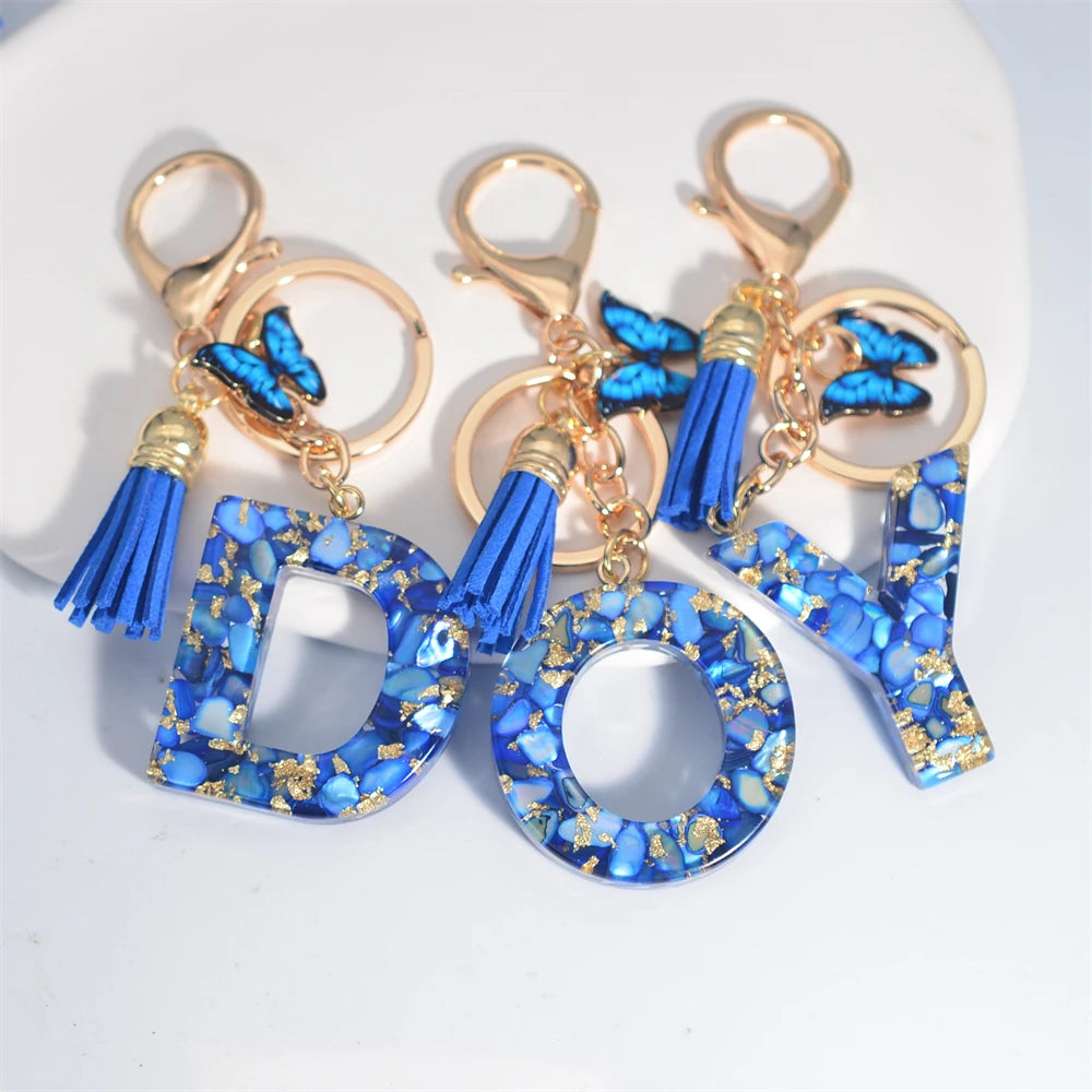 Blue Acrylic Initial Keychain with Butterfly and Tassel