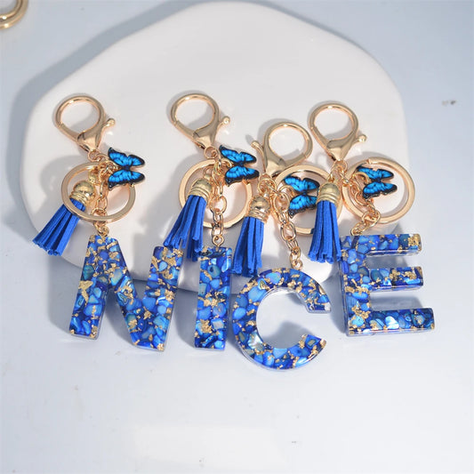 Blue Acrylic Initial Keychain with Butterfly and Tassel